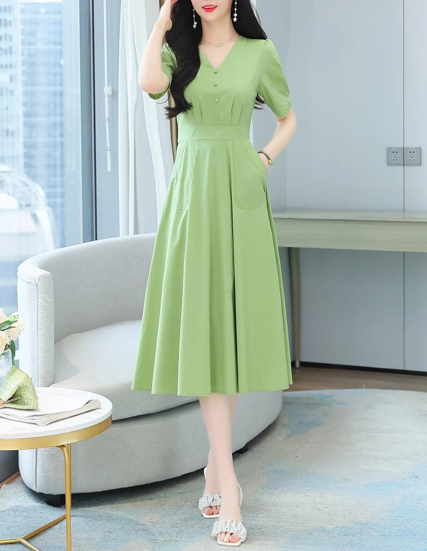 Sweet French-style dress featuring button decoration and a fitted waist