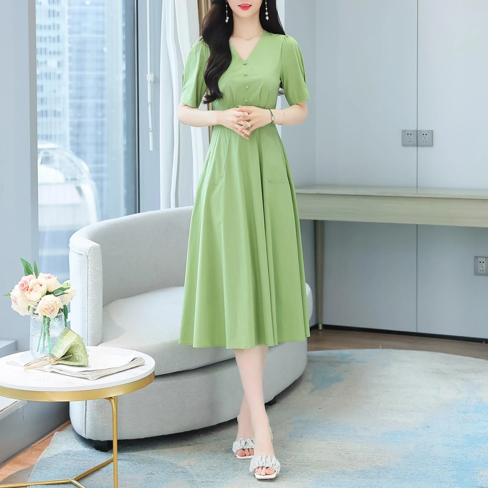 Sweet French-style dress featuring button decoration and a fitted waist