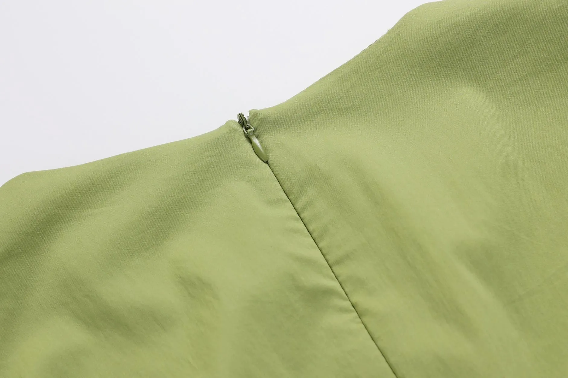 Sweet French-style dress featuring button decoration and a fitted waist