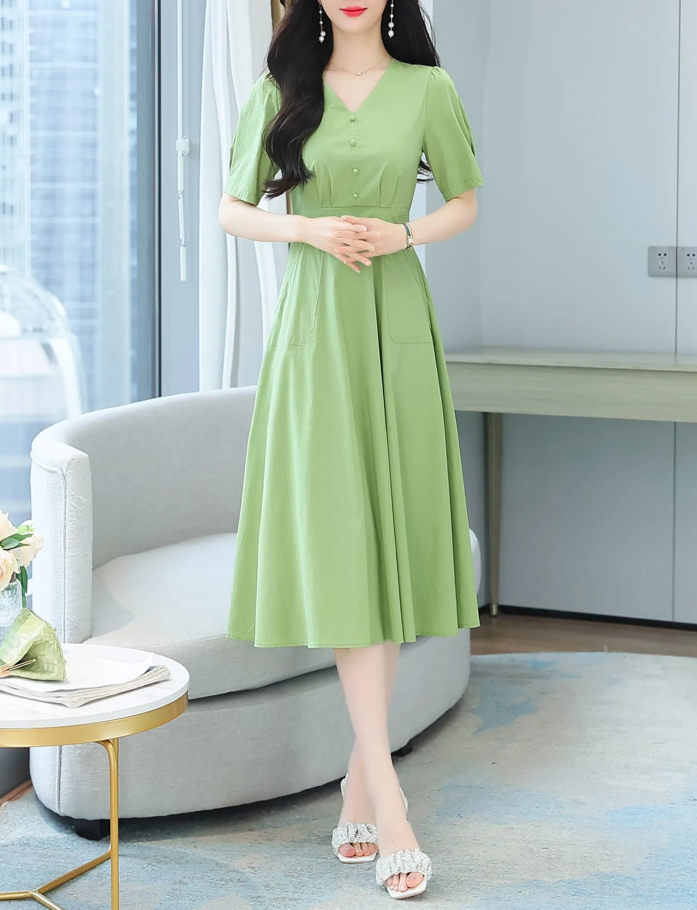 Sweet French-style dress featuring button decoration and a fitted waist