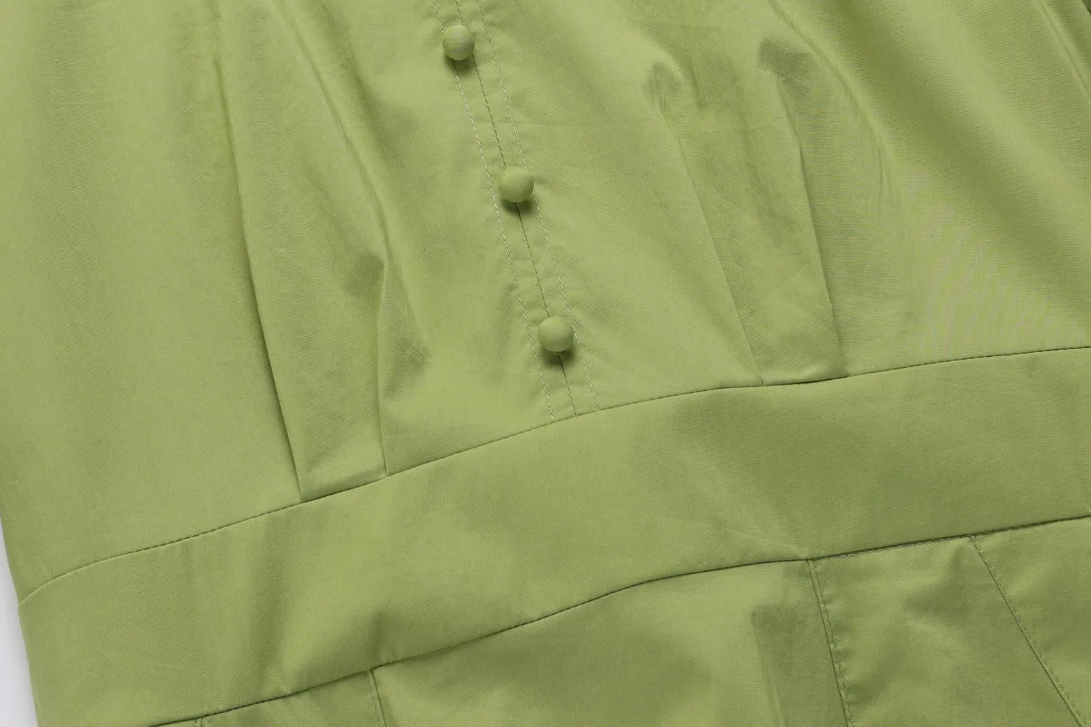 Sweet French-style dress featuring button decoration and a fitted waist