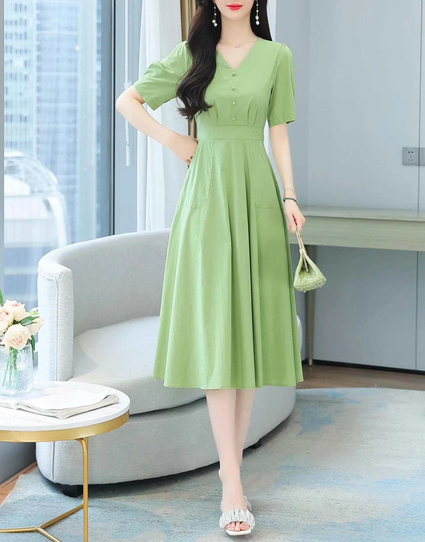 Sweet French-style dress featuring button decoration and a fitted waist