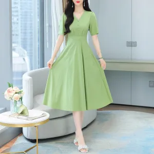 Sweet French-style dress featuring button decoration and a fitted waist